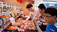 Asian Family Customers Shopping in The Super Market