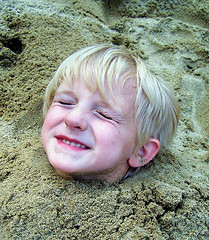 Free Child Buried in The Sand Creative Commons